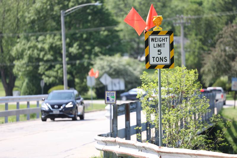 Traffic moves along over the West Seil Road bridge on Saturday, May 20 in Shorewood. The village posted a new weight limit for the bridge.