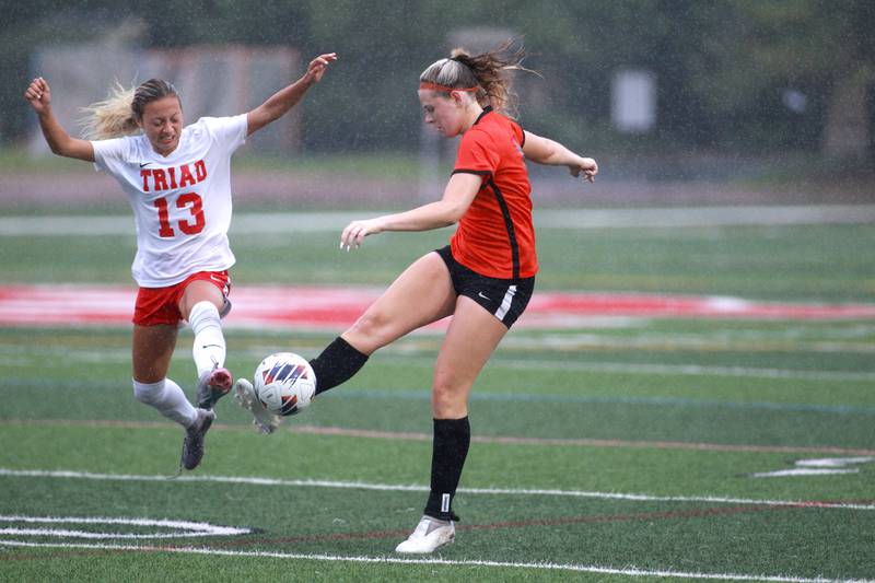 Crystal Lake Central’s Paiton Hulata (right) kicks the ball away from Triad’s Emma Correale during the Class 2A state championship game at North Central College in Naperville on Saturday, June 1, 2024.