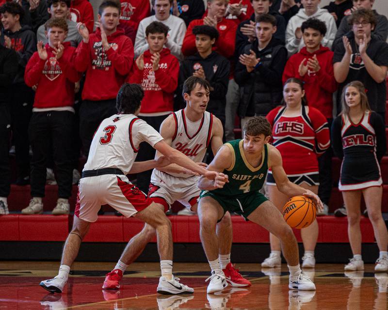 Gino Ferrari (4) of St. Bede dribbles ball whilst being surrounded by Hall's defense on Saturday, January 31, 2026 at Hall High School in Spring Valley.
