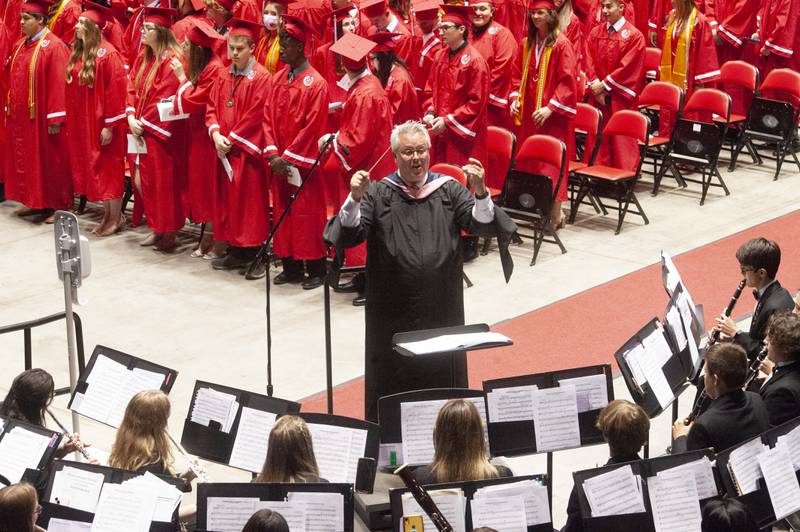 Victor Andersen directs the band in the playing of "Pomp and Circumstance" during Yorkville High School's class of 2022 graduation ceremony at the NIU Convocation Center on Friday, May 20, 2022.