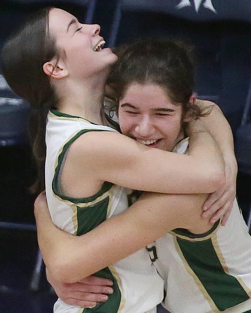 St. Bede's Bailey Engels hugs teammate Lily Bosnich after winning the Class 1A Regional semifinal game over Marquette on Monday, Feb,. 12, 2024 in Bader Gym.