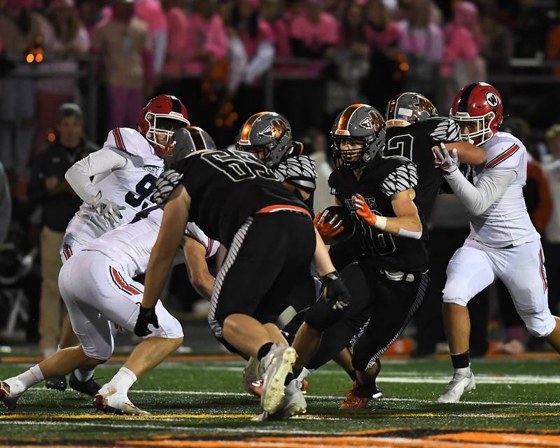 Minooka Ethan Murphy (16) tries to break a big run against West Aurora on Friday, Oct.  22, 2021, at Minooka High School in Minooka, IL