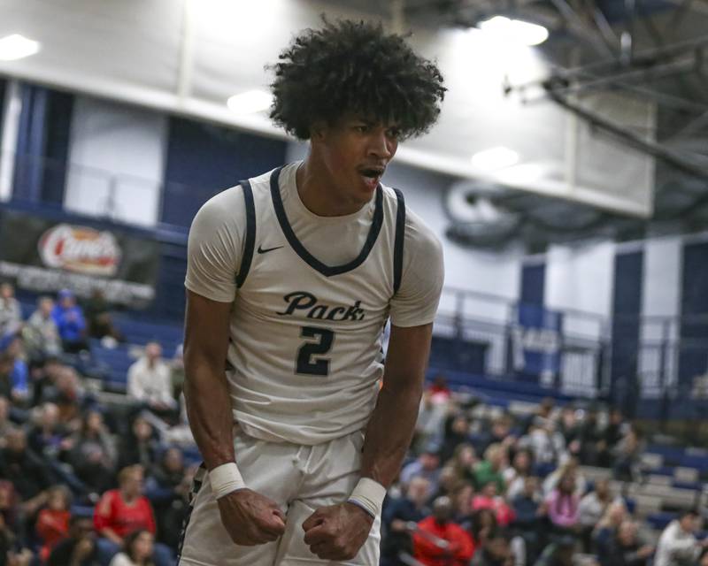 Oswego East's Jacsen Tucker (2) reacts after scoring an and-one during their basketball game between Yorkville at Oswego East. Friday, Dec 19, 2025 in Oswego.