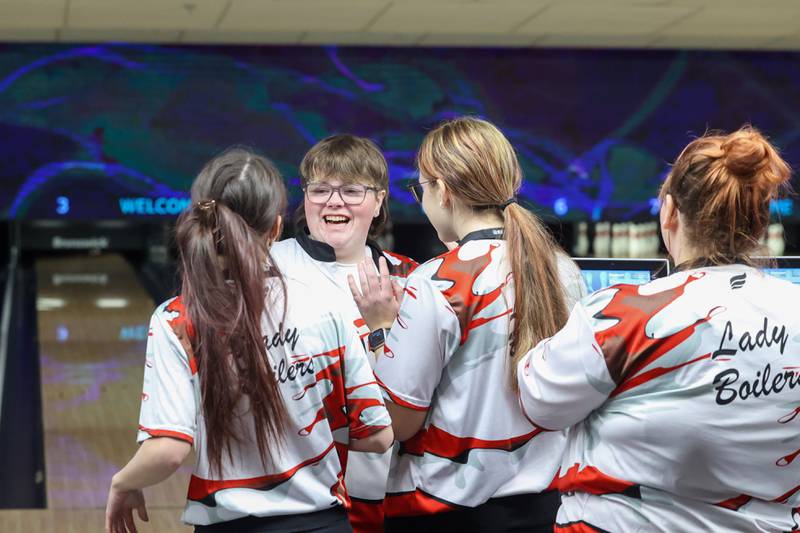 Bradley-Bourbonnais bowlers celebrate teammate Bri Dyer-Riegle as she bowled three strikes in her final frame during the Boilermakers' victory over Kankakee, Peotone and Bishop McNamara in the All-Area matchup on Wednesday, Feb. 4, 2026. Dyer-Riegle tallied a 583 series scoreto claim the individual All-Area title and lead the Boilermakers to a team win.