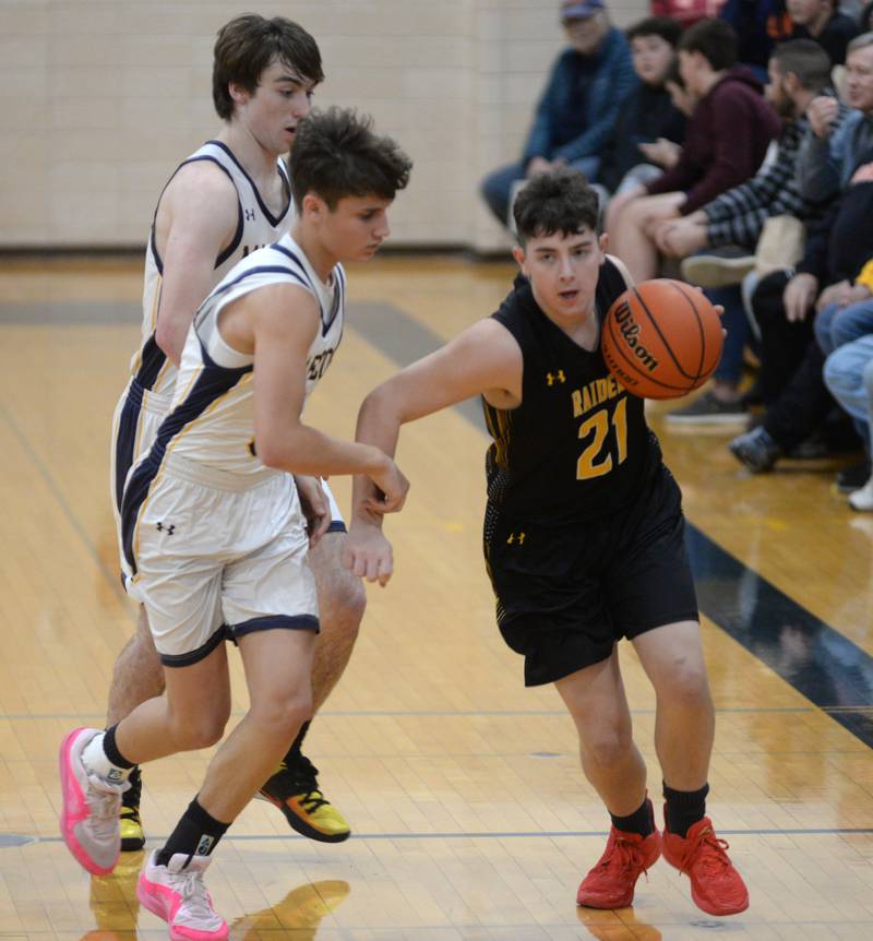 Ashton-Franklin Center's Logan O'Brien dribbles against a Polo defender on Tuesday, Jan. 2, 2024 at Polo High School.