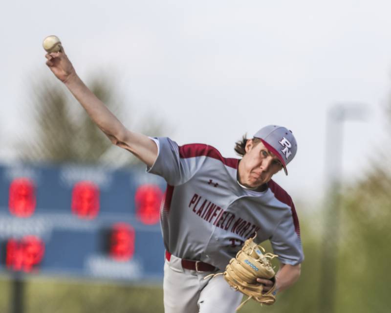 Plainfield North's Will Burke (17) delivers to the plate during baseball game between Plainfield North at Oswego East, Monday, April 28, 2025 in Oswego.