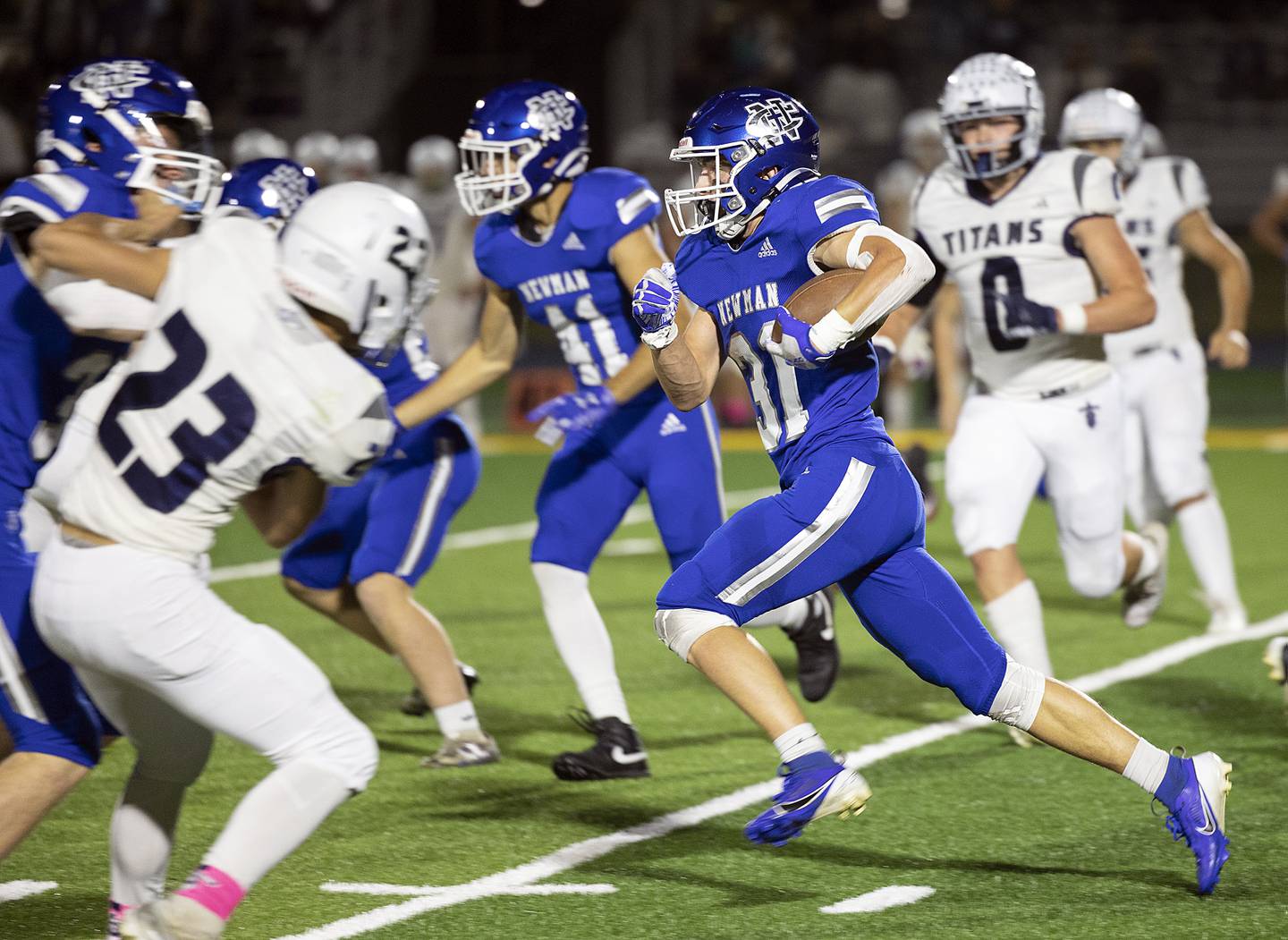 Newman’s Cody McBride picks up yards against Monmouth-Roseville Friday, Oct. 25, 2024, at Roscoe Eades Stadium in Sterling.