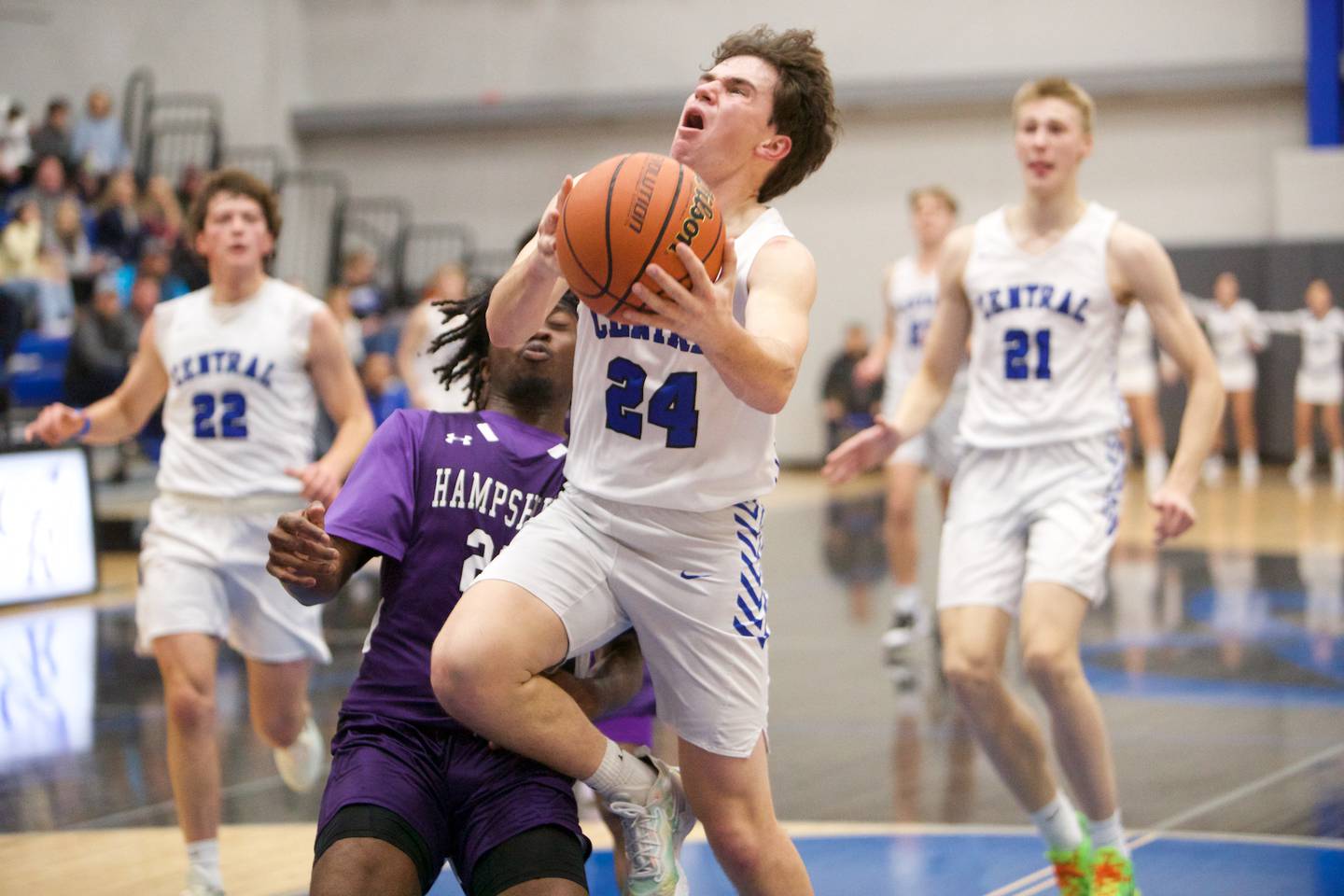 Burlington Central's Matthew Lemon is fouled by Hampshire's Aman Adeshina on Wednesday, Nov. 30,2022 in Burlington.