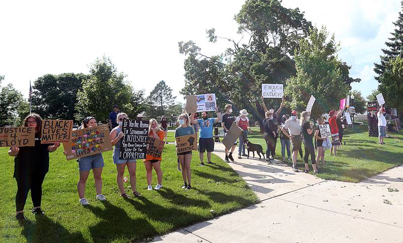 Protesters hold signs while attending the "Black Lives Matter" gathering at Darius Miller Park in Princeton on June 4th.