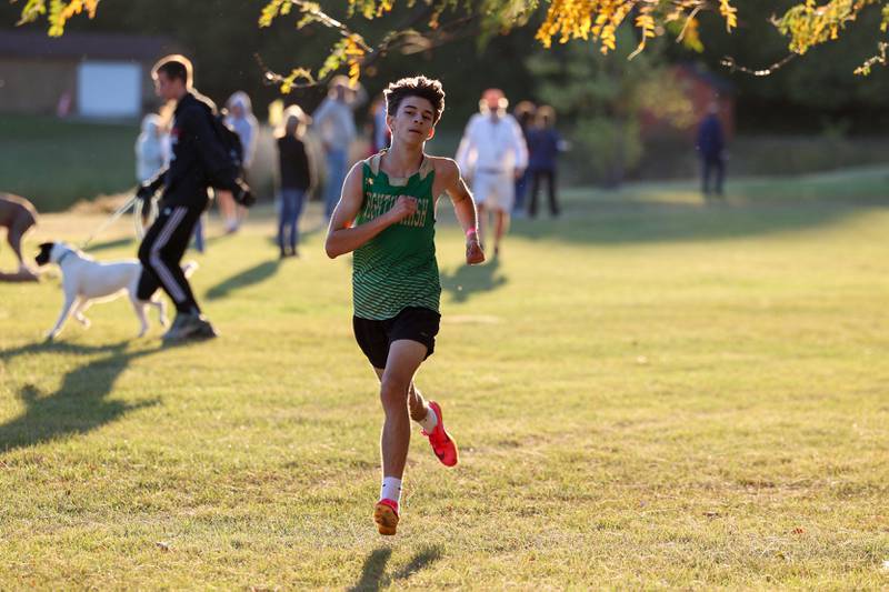 Bishop McNamara's Sebastian Cortes runs the final stretch in the boys 3-mile race during All-Area Cross Country meet on Wednesday, Oct. 8, 2025, at Kankakee Community College.