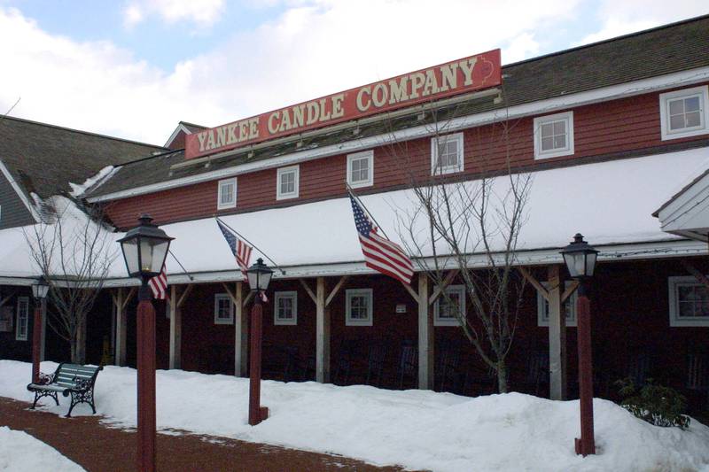 FILE - Yankee Candle Co.'s flagship store in Deerfield, Mass., photgraphed on Jan. 25, 2001. The candle maker, wholesaler and retailer said Wednesday that it was laying off about 14 percent of its work force. It will close its Salt Lake City distribution center, cutting about 180 jobs, and will also cut about 275 staff positions at its Deerfield and Whately, Mass., facilities. The company is going ahead with plans to open a new distribution center in Deerfield.     (AP Photo/Matthew Cavanaugh/ File)