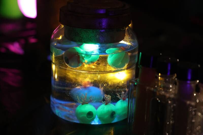 A jar of eyes sits on a table in Haunted Lab at the STEAM Spooktacular hosted by the After the Peanut Foundation on Wednesday at Lewis University.