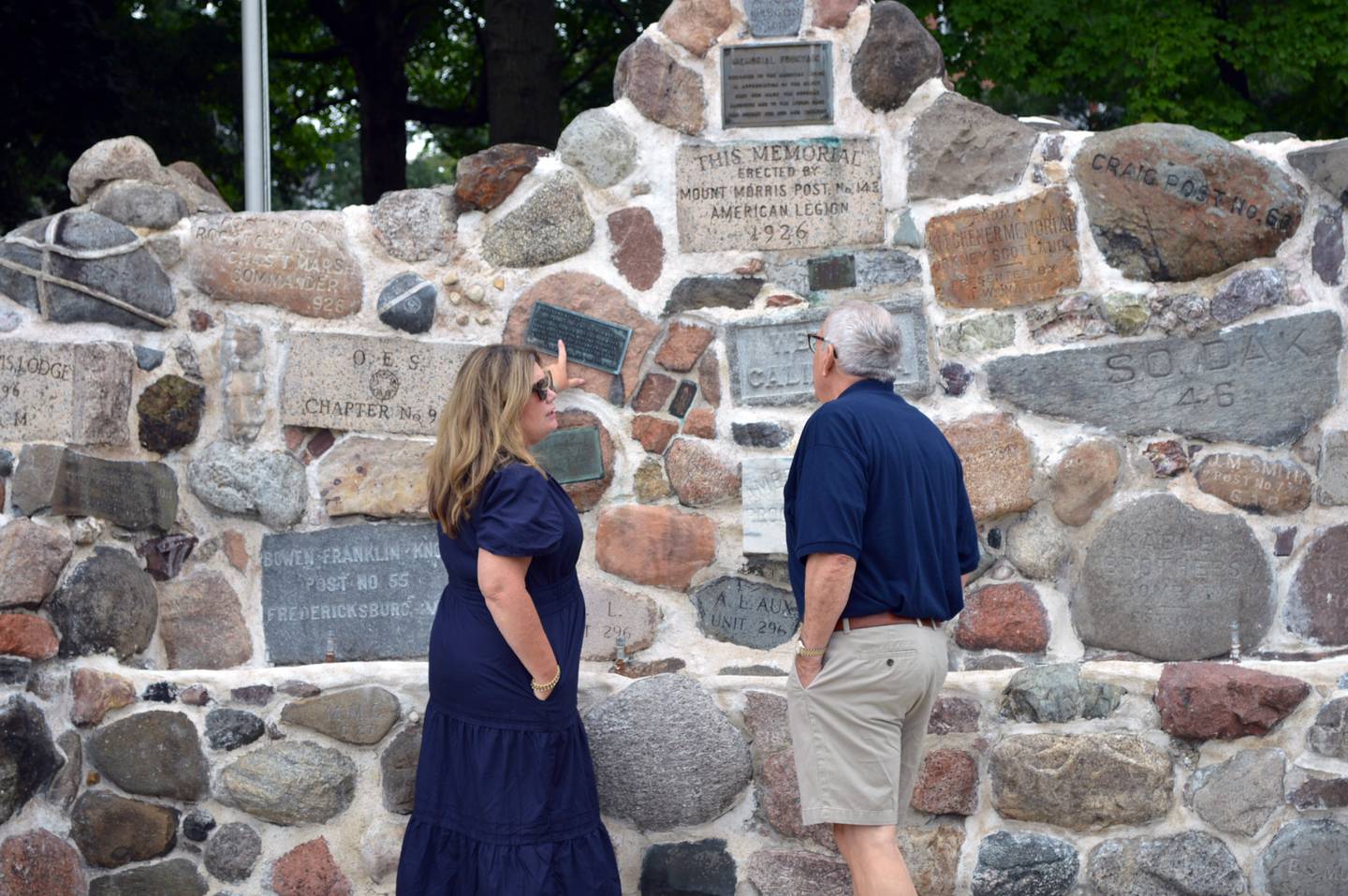 Kohler Foundation senior manager of art preservation Liesl Testwuide (left) and Mt. Morris Economic Development Corporation Chairperson Rob Urish on Thursday, Aug. 29, 2024, look at the recently restored Veterans Memorial Fountain in downtown Mt. Morris. The Kohler Foundation, of Kohler, Wisconsin, funded the fountain's restoration at no cost to the village.