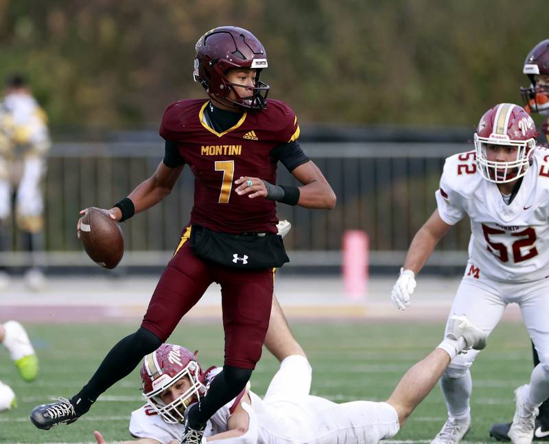 Montini's Israel Abrams (7) slips past a Morris defender during the IHSA Class 4A semifinals football playoff game Saturday, Nov. 22, 2025 in Lombard.