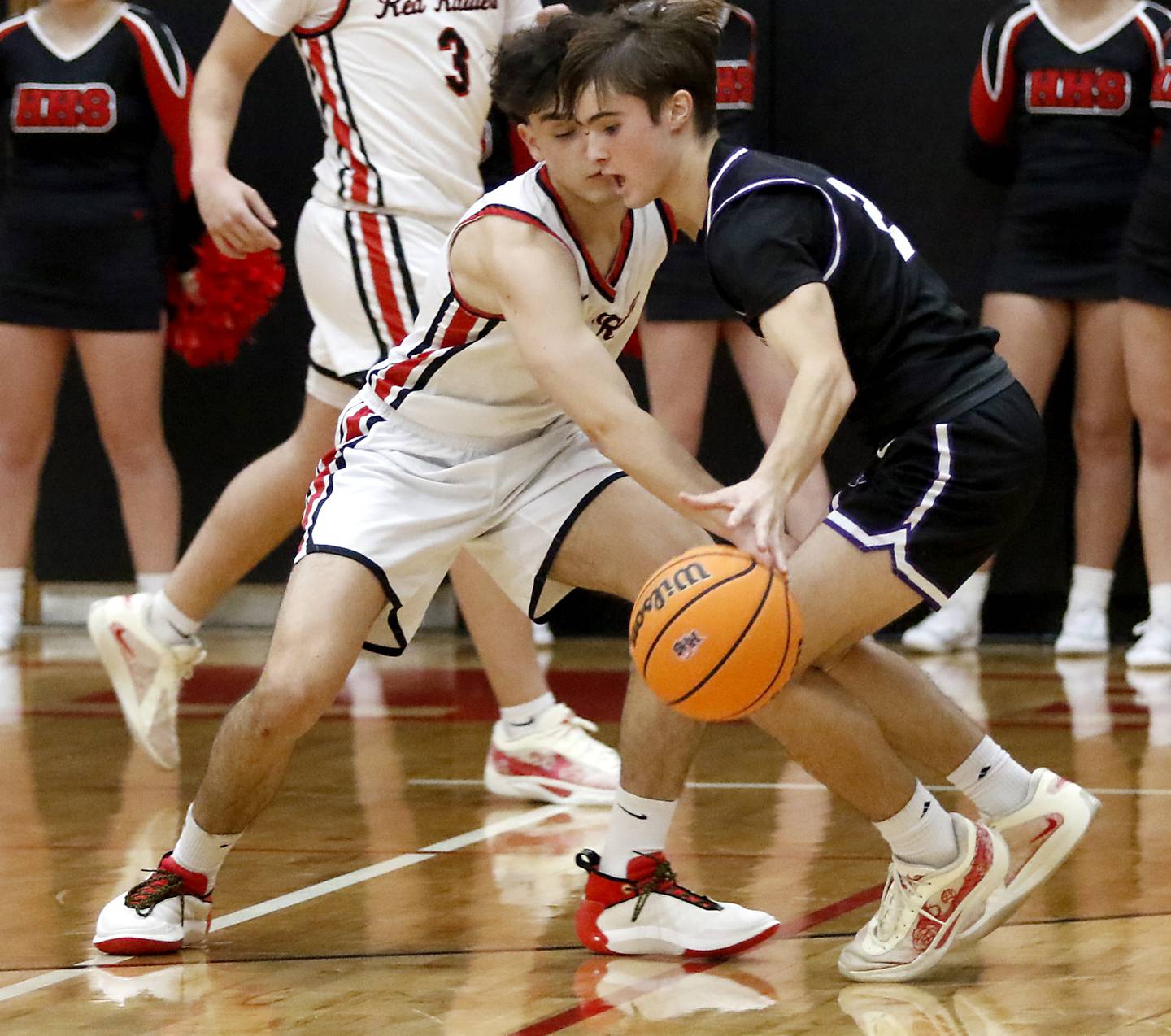 Huntley's Christian Wilson tries to steal the ball from Hampshire's Cole Harkin during a Fox Valley Conference boys basketball game on Friday, Dec. 8, 2024, at Huntley High School.