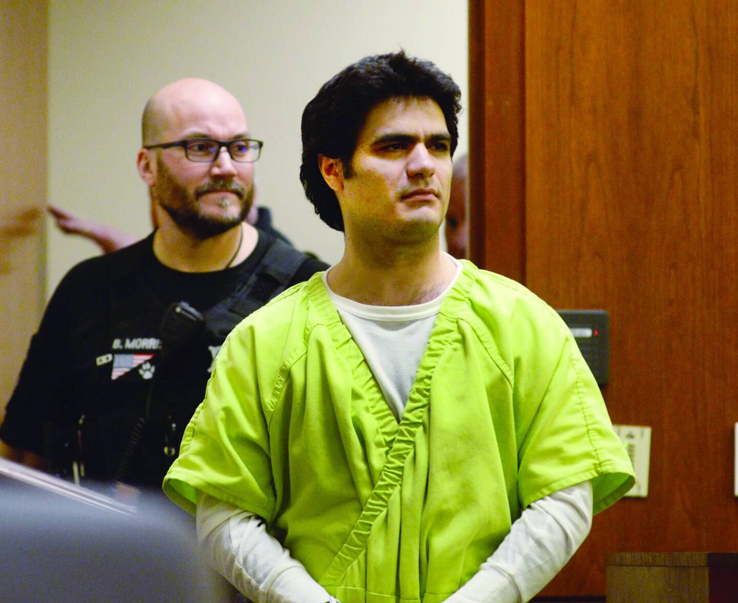 Jonathon Gounaris is escorted into a courtroom at the Ogle County Judicial Center in Oregon on Monday, April 7, 2025, for a pretrial release hearing. He is charged with shooting three police officers during a June 2024 incident at his home in rural Dixon. He is being held at the Winnebago County Jail as his attempted murder case proceeds through the court system.