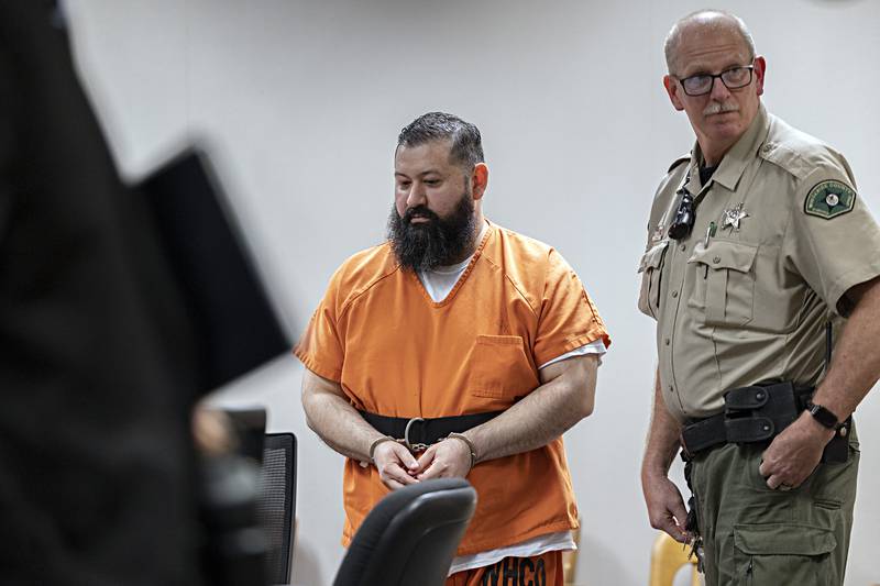 Michael Bennett is led from the courtroom Thursday, Oct. 19, 2023 in Whiteside County court. Bennett was convicted of two counts of first degree murder and sentenced to 60 years in prison.