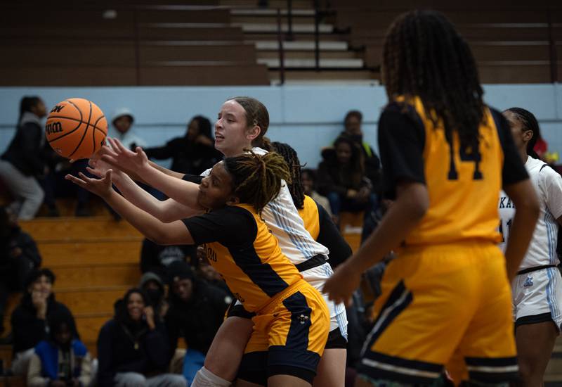 Kankakee's Ava Johnson, back, and Thornwood's Ashlee Veley, front, compete for a rebound in a game on Thursday, December 11, 2025.