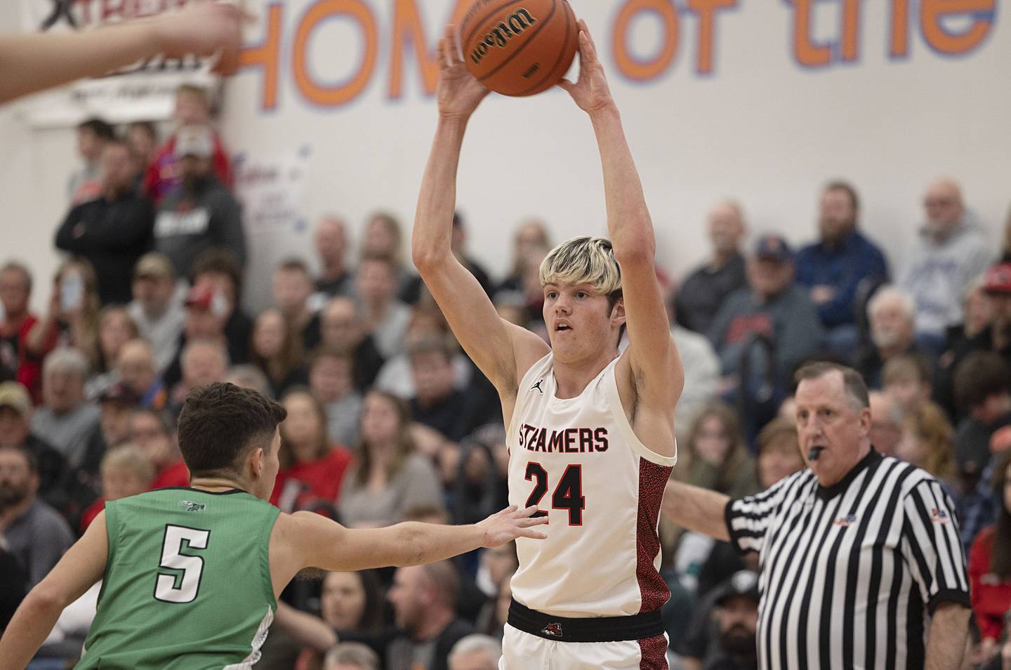 Fulton’s Daken Pessman makes a pass against Scales Mound’s Charlie Wiegel Friday, March 3, 2023 in the 1A sectional final in Lanark.