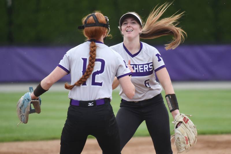 Manteno's Aubrie Goudreau, right, and Savanna Watkins perform their pre-inning handshake during a home game against Herscher Tuesday, May 12, 2026.