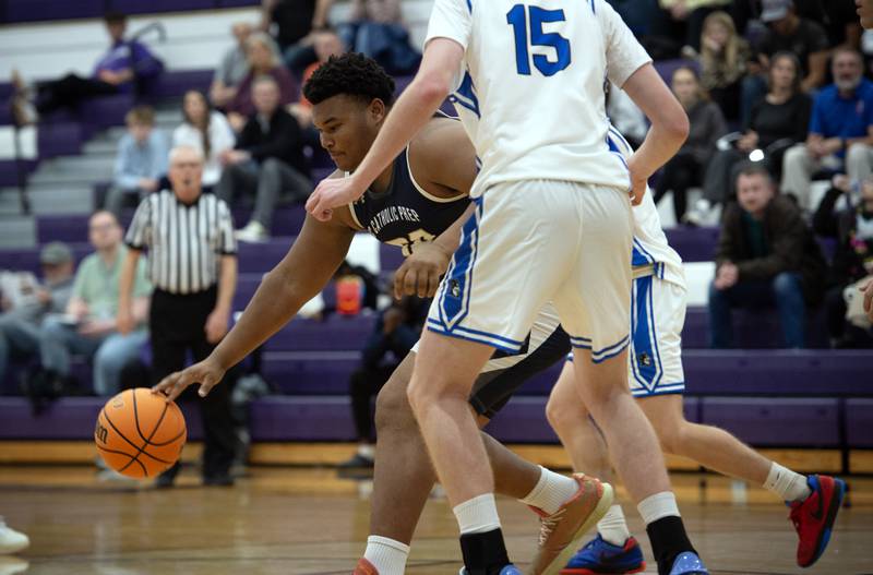 IC Catholic's Joshua Shaw controls the ball against Peotone in the Thanksgiving tournament at Manteno High School on Monday, November 24, 2025.