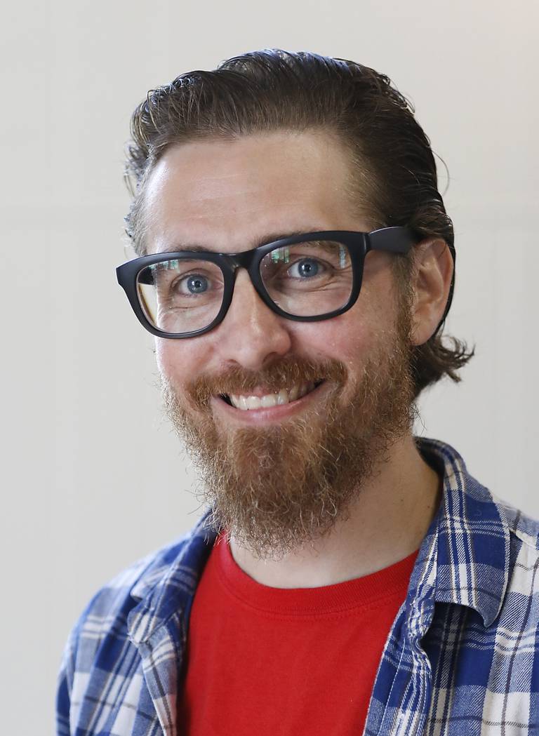 Josh Stevens, the head librarian at Hebron Public Library on Thursday, Aug. 25, 2022. Stevens is a teacher during the day and the librarian for the privately funded Hebron library at night.