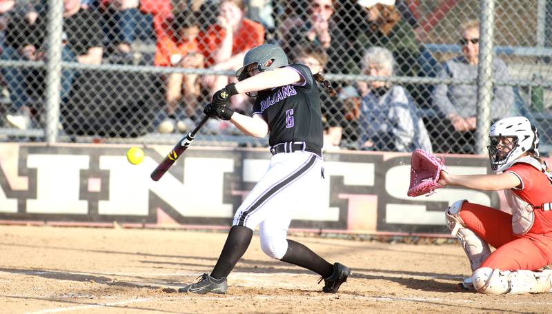 Downers Grove North's Sophia Lawson makes contact with the ball during a game against St. Charles East on Friday, March 28, 2025 in St. Charles.