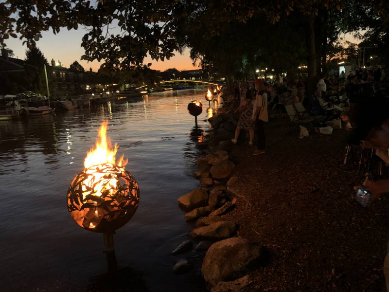 Residents pulled up with chairs around the fire globes at McHenry's Miller Point Park on Saturday, Sept. 27, 2025 during the annual Light the Night. The city lights fires in the 15 fire globes sitting in  the water along the McHenry Riverwalk.