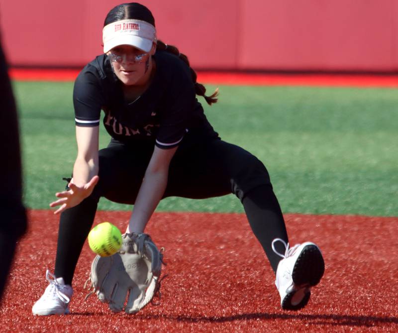 Huntley’s Aubrina Adamik scoops up a grounder against Barrington in IHSA Class 4A Sectional Title Game softball action at the Fields of Dreams on the campus of Barrington High School in Barrington on Friday, June 6, 2025.