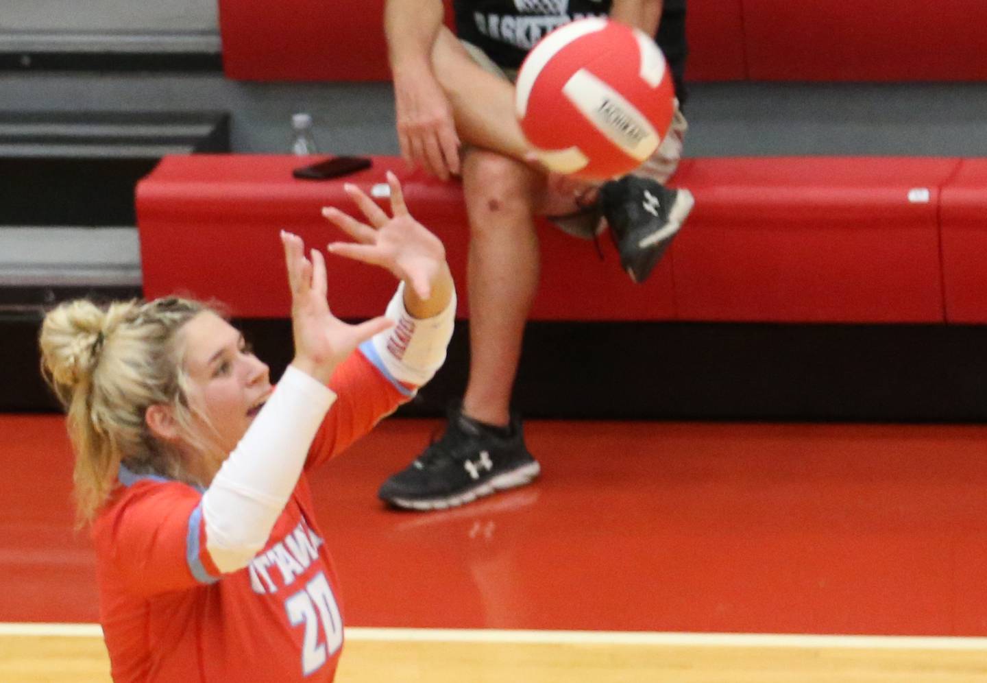 Ottawa's libero Reese Burgwald sets the ball in play against Plano on Thursday, Aug. 31, 2023 in Kingman Gym at Ottawa High School.