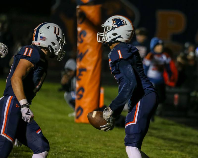 Oswego's Jeremiah Cain (1) celebrates a touchdown reception during Class 8A second- round football game between York at Oswego on Friday, Nov 8, 2024  in Oswego.