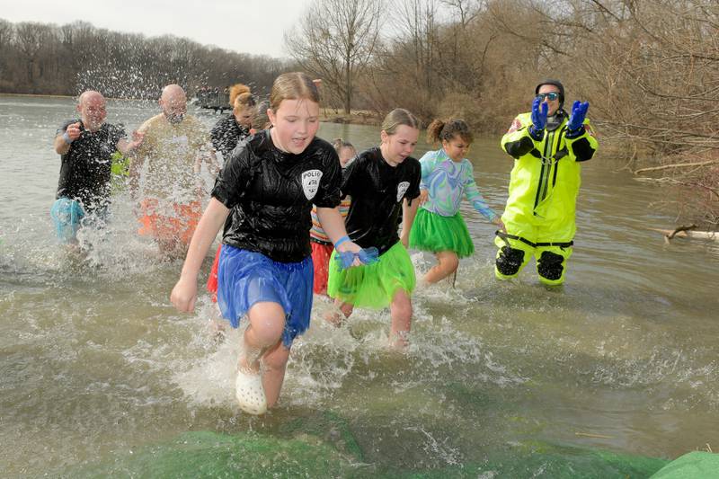 A team from the Montgomery Police Department take part in the Law Enforcement Torch Run Polar Plunge for Special Olympics Illinois Athletes at Silver Springs State Park on Sunday, Mar 1, 2026 in Yorkville.