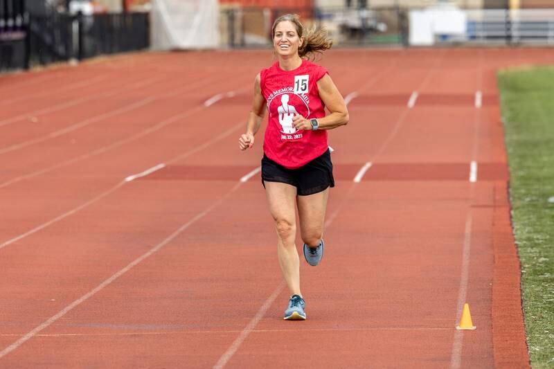 Jamie Moss crosses the finish line at Ben’s Memorial Mile, a community festival held every summer to raise money and awareness for mental health and suicide prevention in honor of Ben Silver, on Saturday, July 22, 2023.