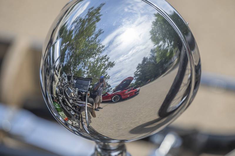 A beautiful scene is reflected in the headlamp of a hot rod Friday, July 4, 2025, in Dixon.