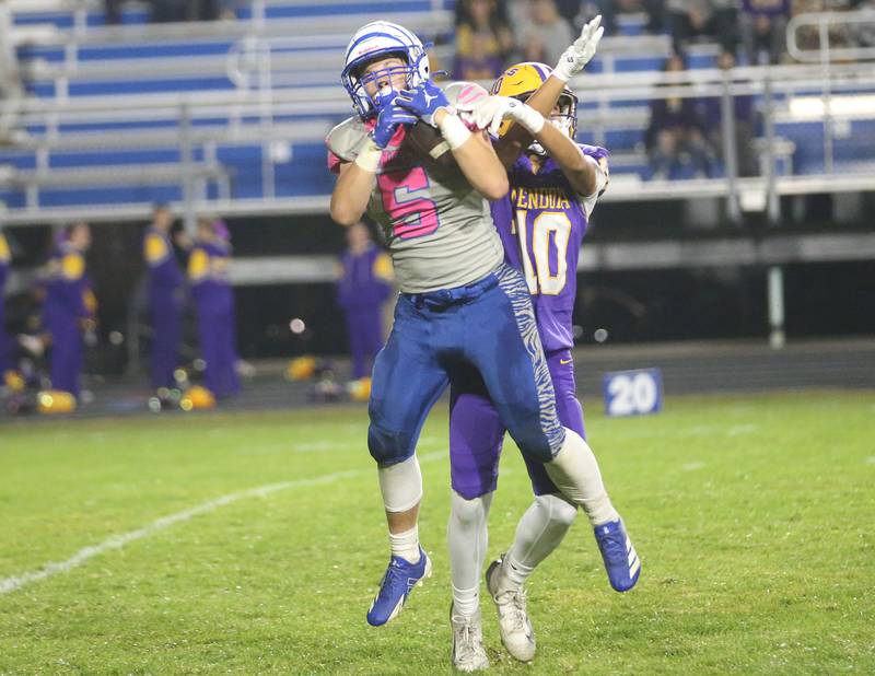 Princeton's Brennen Emmett makes a catch over Mendota's Viktor Angulo on Friday, Oct. 10, 2025 at Bryant Field in Princeton.