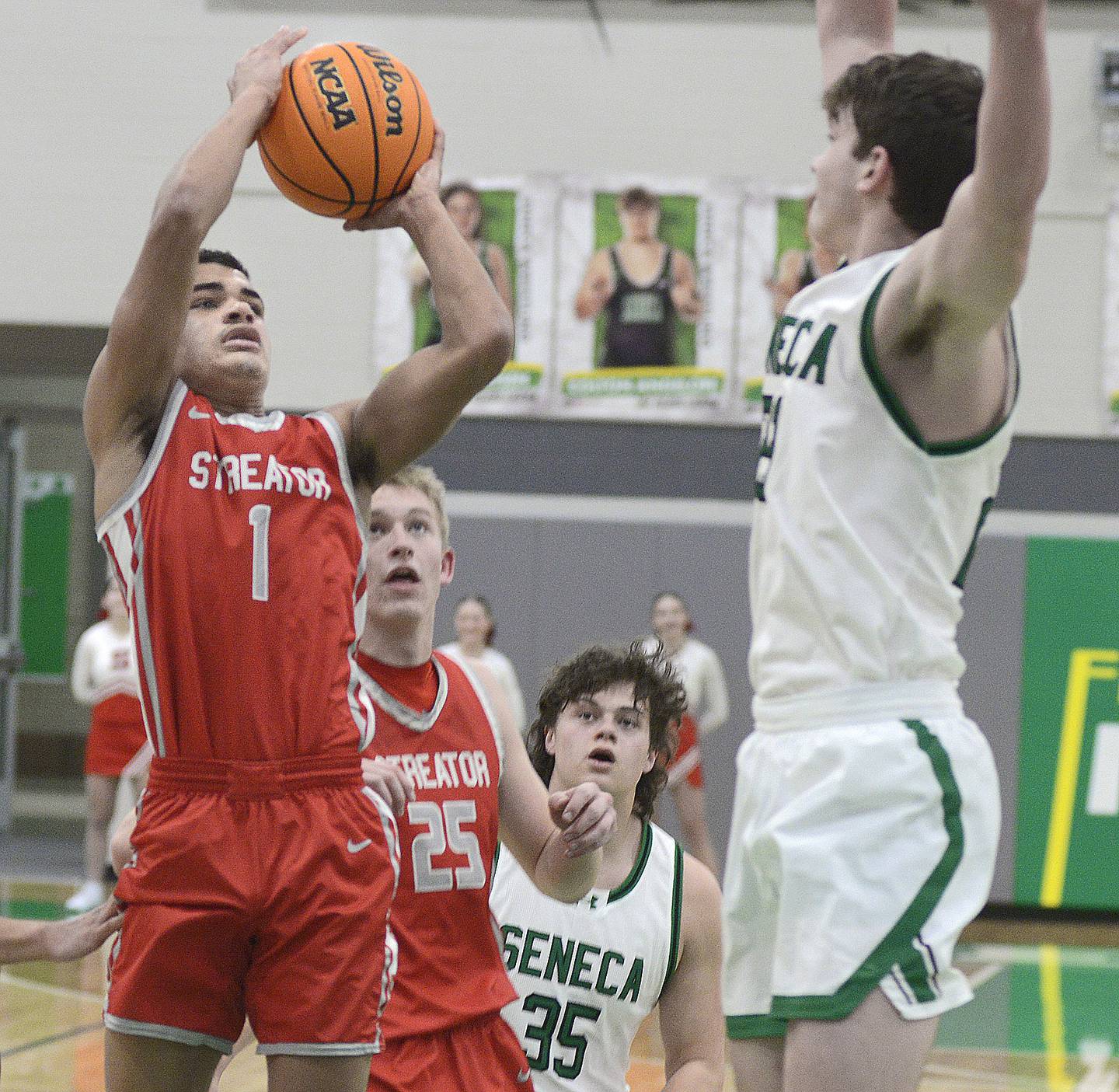Streator’s Layzeric Moton get a shot away over the arms of Seneca’s Brady Sheedy in the 1st period Tuesday at Seneca.