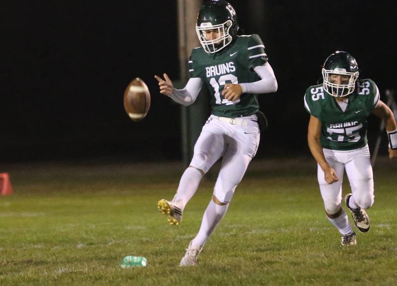 St. Bede's Ryan Soliman kicks the ball to Peoria Notre Dame as teammate Brock Pikul (65) watches on Friday, Oct. 17, 2025 at St. Bede Academy.