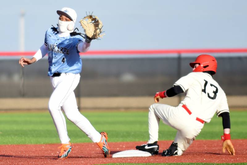 Kankakee's Mike Prude, left, fields a late throw at second as Bradley-Bourbonnais' Trenton Burge slides in during a game at 315 Sports Park in Bradley Friday, March 27, 2026.
