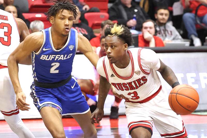 Northern Illinois Huskies guard Kaleb Thornton gets around Buffalo Bulls guard Kidtrell Blocker Tuesday, Feb. 28, 2023, during their conference matchup at the Convocation Center at NIU.