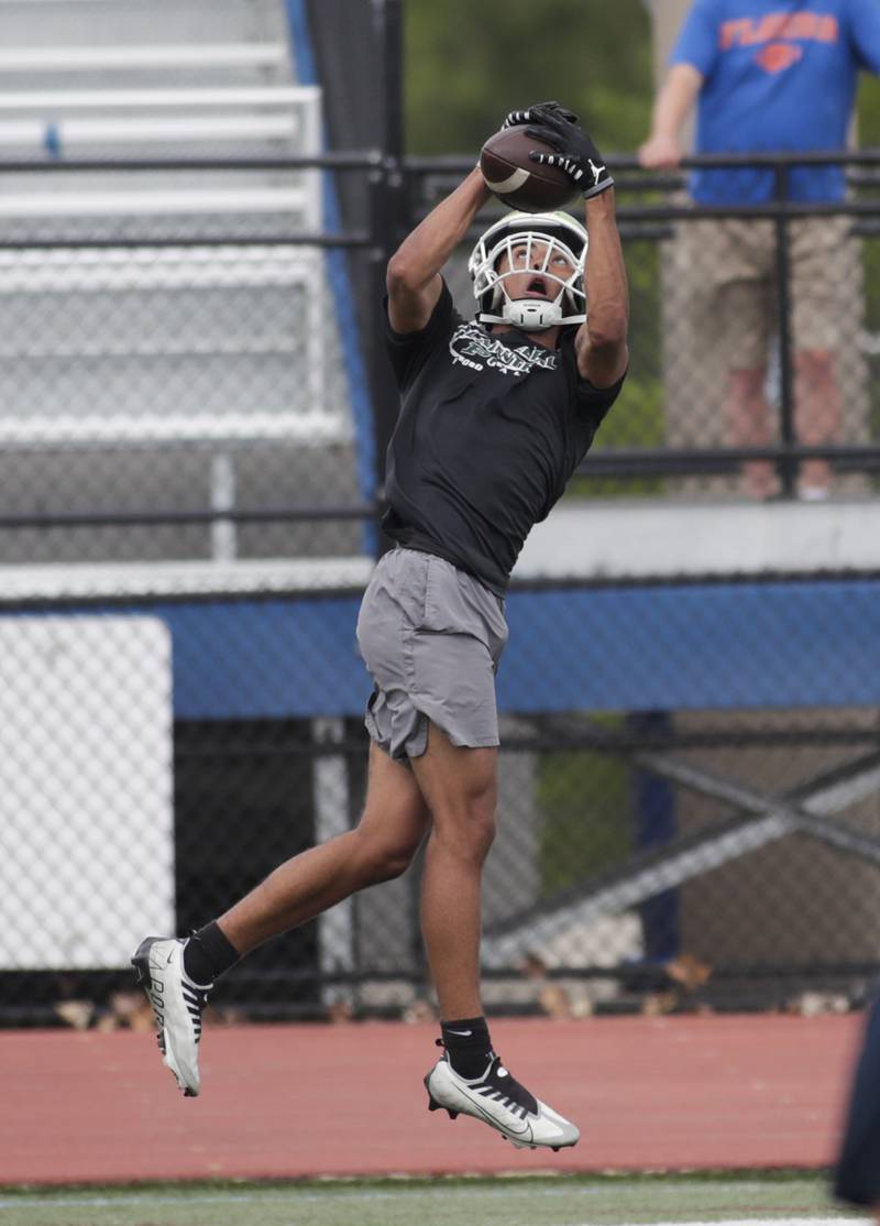 Plainfield Central’s Colby Williams catches a pass during the Downers Grove South 7-on-7 in Downers Grove on Saturday, July 16, 2022.