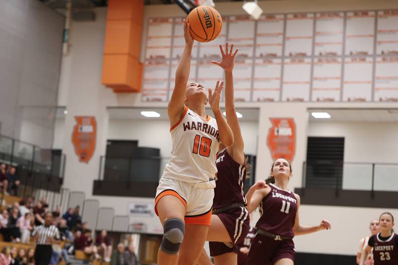 Lincoln-Way West’s Molly Finn lays in a shot against Lockport on Tuesday, Feb. 3, 2026 in New Lenox.