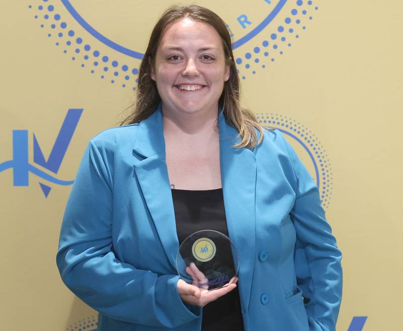 Sarah Finley poses with her 40 Under Forty award during the Illinois Valley Chamber of Commerce Champions of Change Awards Night on Wednesday, May 6, 2026 at the Westclox Event Center in Peru.