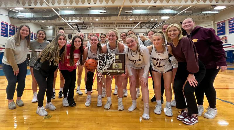 Montini celebrates their victory for the 3A Glenbard South Sectional basketball championship over Providencel at Glenbard South High School in Glen Ellyn on Thursday, Feb 23, 2023.