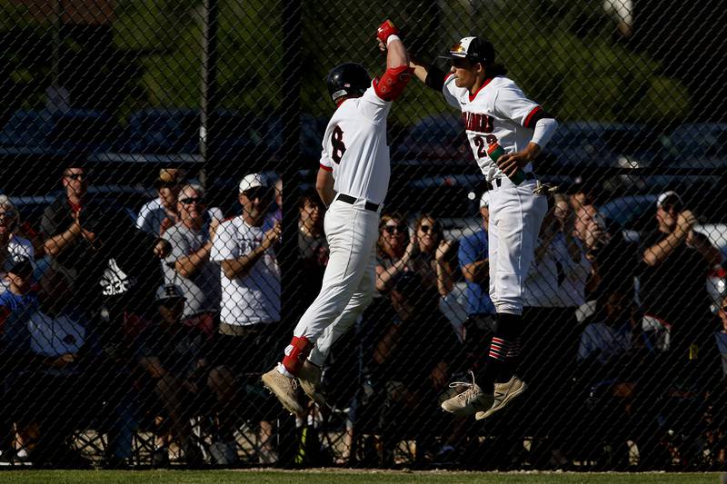 Huntley’s Brayden Bakes celebrates Chase Jetel after hitting a home run during a IHSA Class 4A baseball sectional semi-final baseball game between Jacobs and Huntley at Jacobs High School in Algonquin.