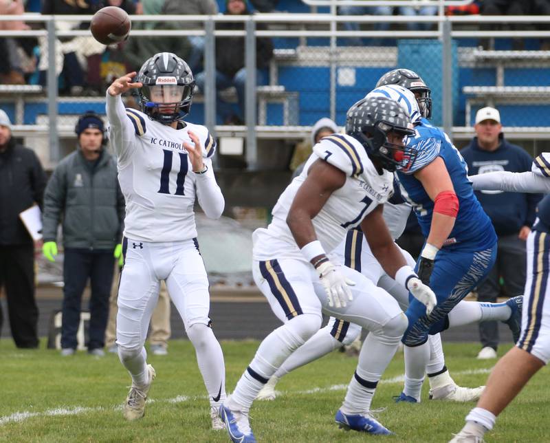 IC Catholic's quarterback Dennis Mandala (11) throws a pass against Princeton in the Class 3A Quarterfinal game on Saturday, Nov. 12, 2022 in Princeton.