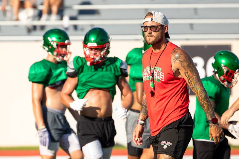 L-P Football Coach, JJ Raffelson walks across field during scrimmage on Tuesday July 16, 2025 at Howard Fellows Stadium in LaSalle.