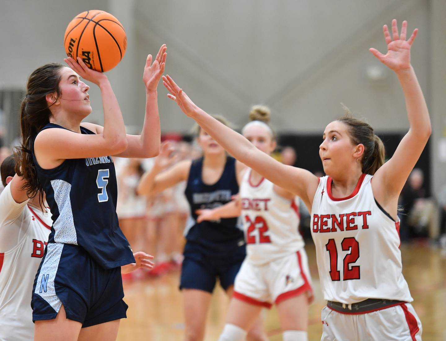 Nazareth’s Sophia Towne (5) shoots over Lindsay Harzich (12) during a game on January 29, 2025 at Benet Academy in Lisle.