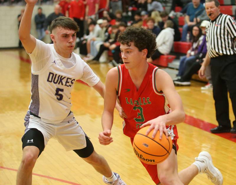 L-P's Mikey Hartman dribbles around Dixon's Erick Sotelo during the Class 3A Regional semifinal game on Wednesday, Feb. 26, 2025 in Sellett Gymnasium at L-P High School.
