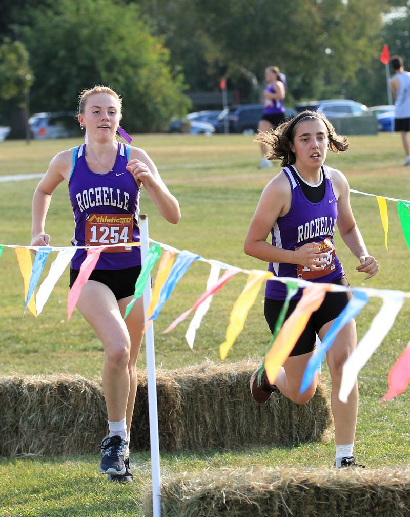 Rochelle's Rose Luxton left) and Vivi Worthington (right) run during a meet held at Skare Park.