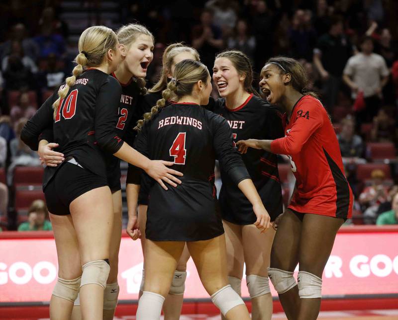 Benet celebrates a point during the IHSA Class 4A girls volleyball state title game between Benet Academy and Mother McAuley Saturday November 12, 2022 at Redbird Arena in Normal.